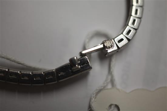 A platinum, iridium and diamond line bracelet, 17.8cm.